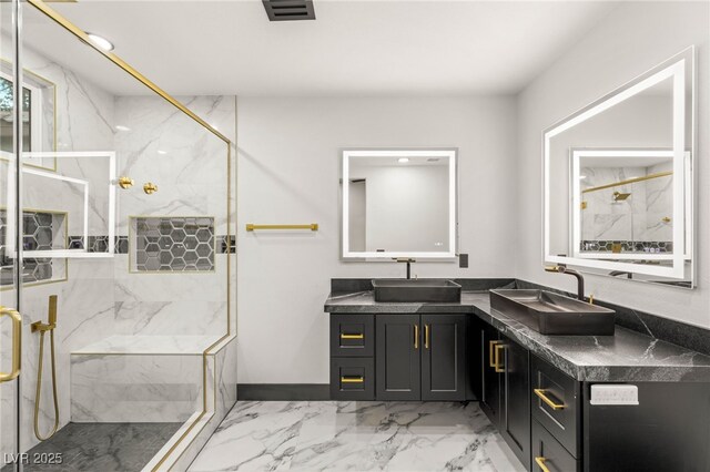 9029 Rivers Edge Dr, Las Vegas, NV 89117 - bathroom featuring a marble finish shower, marble look tiles, and double vanity