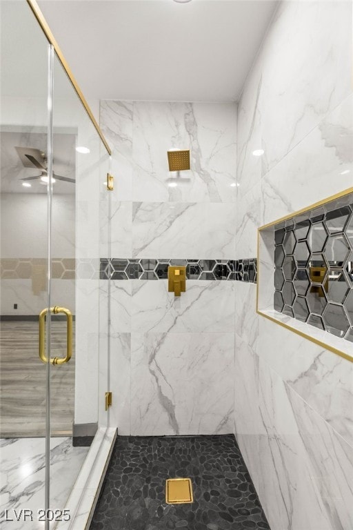 9029 Rivers Edge Dr, Las Vegas, NV 89117 - full bathroom featuring a marble finish shower, ceiling fan, and marble finish flooring