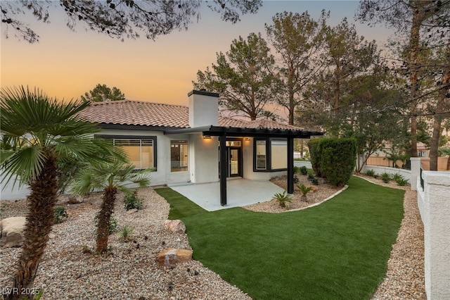9029 Rivers Edge Dr, Las Vegas, NV 89117 - rear view of house with a tile roof, a patio area, a chimney, and stucco siding