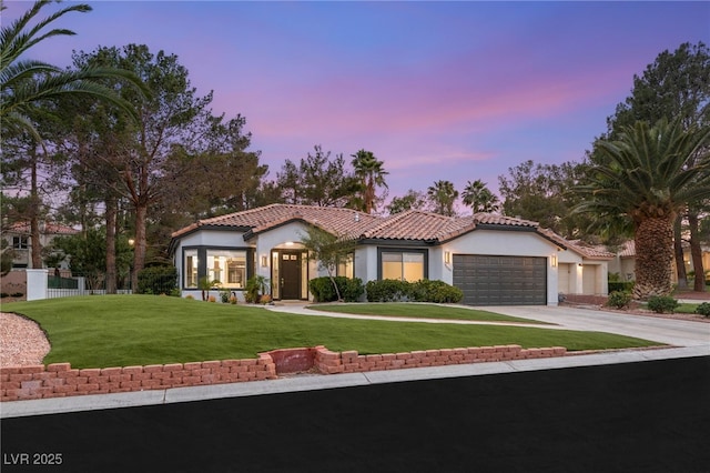 9029 Rivers Edge Dr, Las Vegas, NV 89117 - mediterranean / spanish home featuring stucco siding, a garage, driveway, and a tile roof
