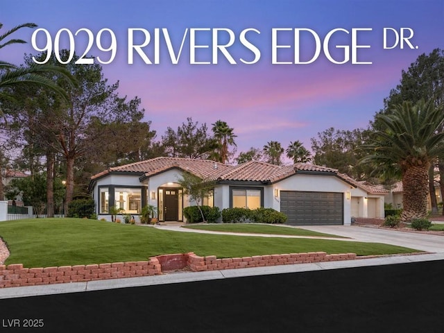 9029 Rivers Edge Dr, Las Vegas, NV 89117 - mediterranean / spanish-style home with a tiled roof, an attached garage, stucco siding, a front yard, and driveway
