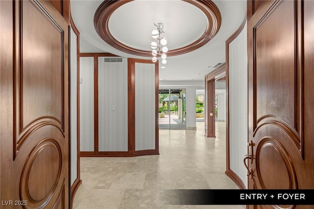 9101 Alta Dr Unit 102, Las Vegas, NV 89145 - corridor with a chandelier, a tray ceiling, and baseboards
