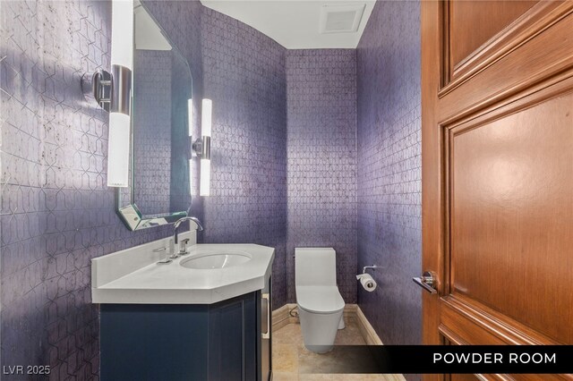 9101 Alta Dr Unit 102, Las Vegas, NV 89145 - bathroom featuring toilet, vanity, and tile patterned floors