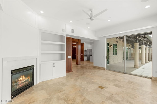 9101 Alta Dr Unit 102, Las Vegas, NV 89145 - unfurnished living room with ceiling fan, recessed lighting, a glass covered fireplace, built in features, and baseboards