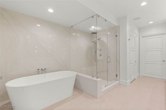 9101 Alta Dr Unit 102, Las Vegas, NV 89145 - full bath featuring a freestanding bath, a shower stall, tile patterned floors, and recessed lighting