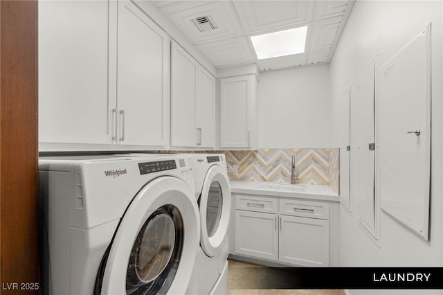 9101 Alta Dr Unit 102, Las Vegas, NV 89145 - washroom with separate washer and dryer and cabinet space