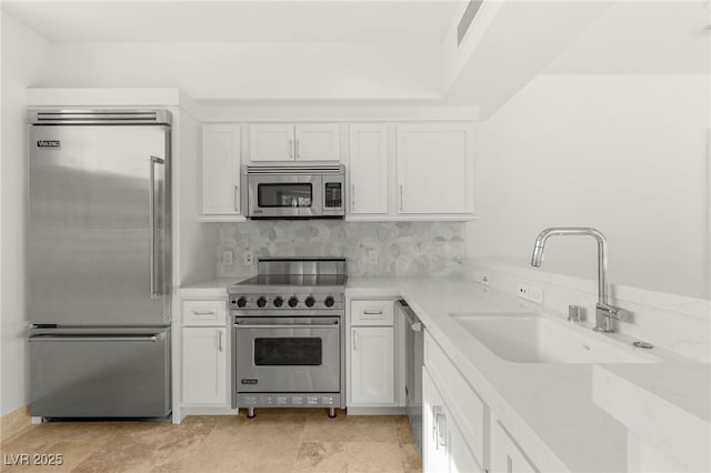 9101 Alta Dr Unit 102, Las Vegas, NV 89145 - kitchen with high quality appliances, a sink, and white cabinetry