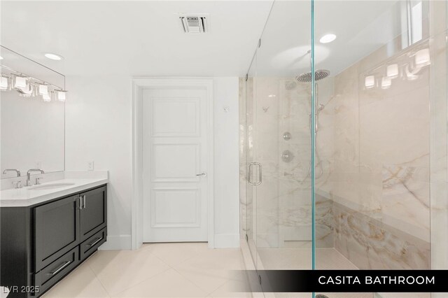 9101 Alta Dr Unit 102, Las Vegas, NV 89145 - full bath with a marble finish shower, vanity, tile patterned floors, and recessed lighting
