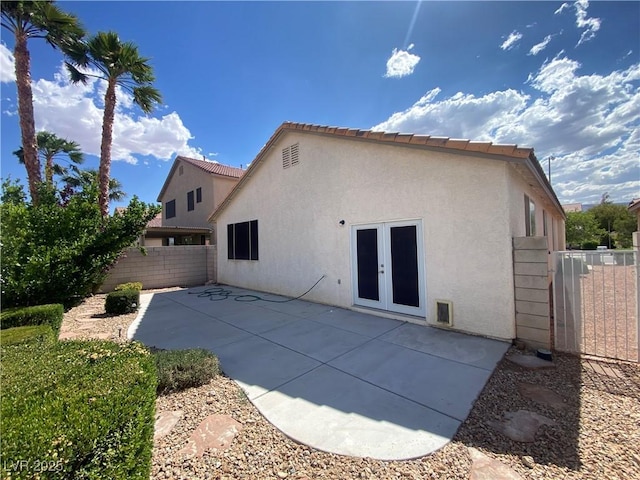 5376 S Conquistador St, Las Vegas, NV 89148 - back of house featuring stucco siding, a patio, french doors, and a tile roof
