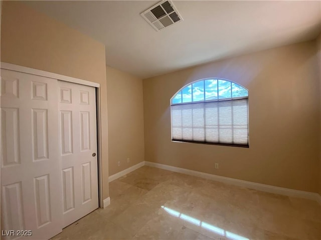 5376 S Conquistador St, Las Vegas, NV 89148 - unfurnished bedroom featuring baseboards and a closet