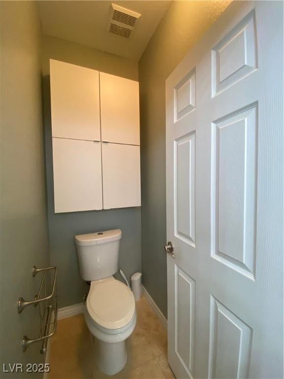 5376 S Conquistador St, Las Vegas, NV 89148 - bathroom featuring baseboards, toilet, and tile patterned flooring