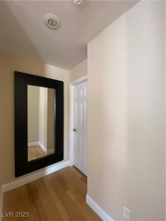 5376 S Conquistador St, Las Vegas, NV 89148 - hallway with light wood-type flooring and baseboards