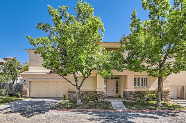 8040 Arcadian Ln, Las Vegas, NV 89147 - obstructed view of property featuring stone siding, an attached garage, stucco siding, and driveway