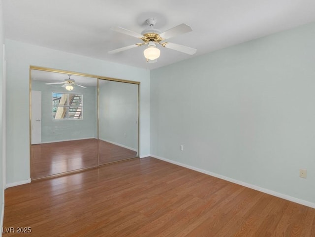 7950 W Flamingo Rd Unit 1077, Las Vegas, NV 89147 - spare room featuring wood finished floors, baseboards, and a ceiling fan