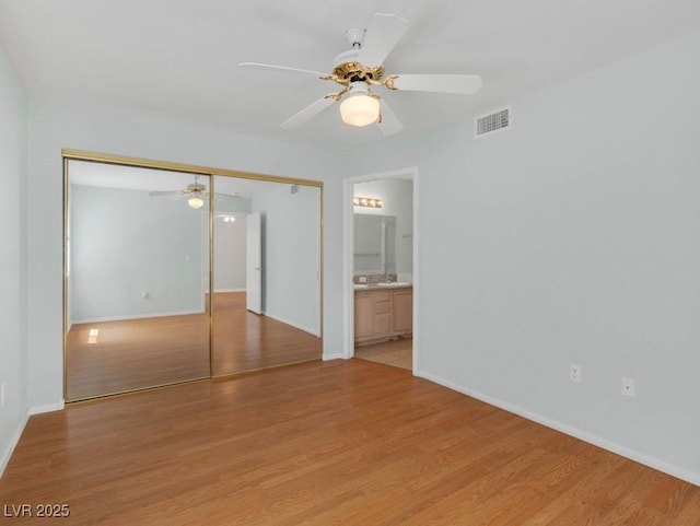 7950 W Flamingo Rd Unit 1077, Las Vegas, NV 89147 - spare room featuring a ceiling fan, light wood-style flooring, and baseboards