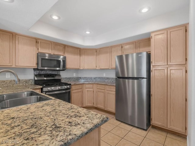 7950 W Flamingo Rd Unit 1077, Las Vegas, NV 89147 - kitchen with stainless steel appliances, a sink, light brown cabinetry, light tile patterned floors, and recessed lighting