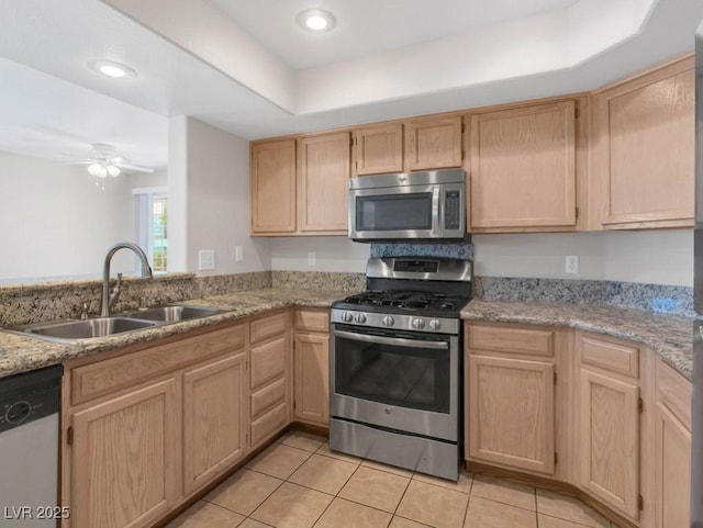 7950 W Flamingo Rd Unit 1077, Las Vegas, NV 89147 - kitchen with stainless steel appliances, a sink, light brown cabinetry, ceiling fan, and recessed lighting