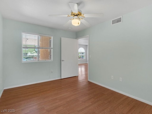 7950 W Flamingo Rd Unit 1077, Las Vegas, NV 89147 - unfurnished room featuring wood finished floors, a ceiling fan, and baseboards
