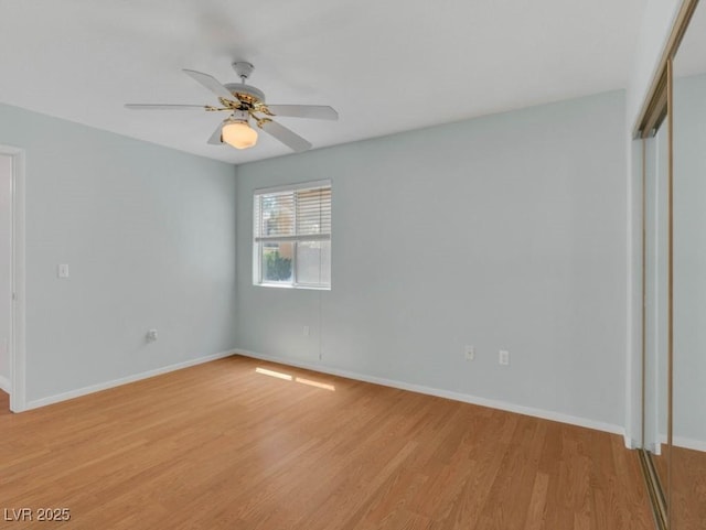 7950 W Flamingo Rd Unit 1077, Las Vegas, NV 89147 - unfurnished bedroom featuring light wood-style floors, baseboards, a closet, and a ceiling fan