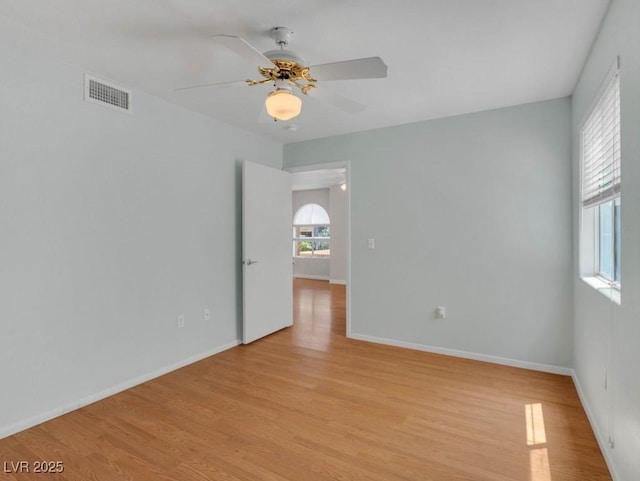 7950 W Flamingo Rd Unit 1077, Las Vegas, NV 89147 - spare room featuring light wood-style floors, a ceiling fan, and baseboards