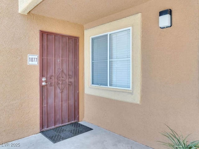 7950 W Flamingo Rd Unit 1077, Las Vegas, NV 89147 - doorway to property featuring stucco siding