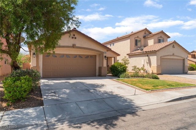 2825 Shayla Bay Ave, North Las Vegas, NV 89086 - mediterranean / spanish-style house with concrete driveway, stucco siding, an attached garage, and a tile roof