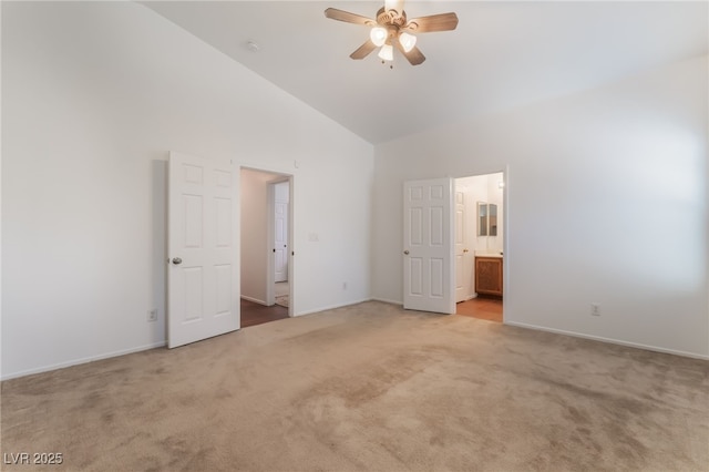 2825 Shayla Bay Ave, North Las Vegas, NV 89086 - unfurnished bedroom with light colored carpet, high vaulted ceiling, baseboards, connected bathroom, and ceiling fan