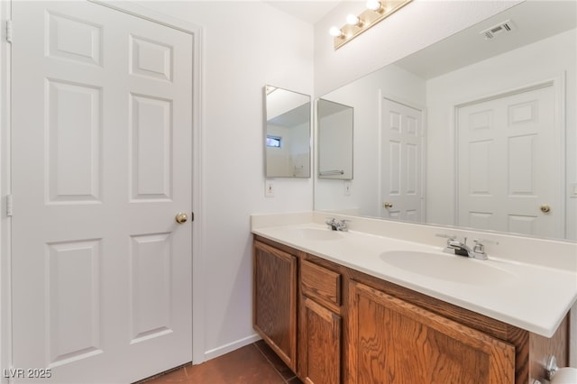 2825 Shayla Bay Ave, North Las Vegas, NV 89086 - full bath featuring double vanity, tile patterned flooring, and baseboards