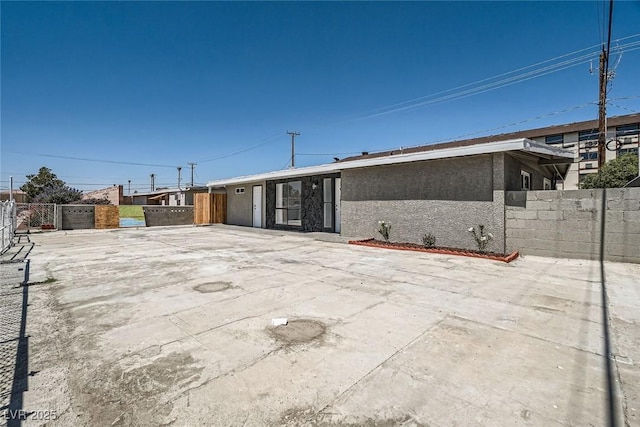 4558 Sheppard Dr, Las Vegas, NV 89122 - view of front of house with stucco siding and a patio area