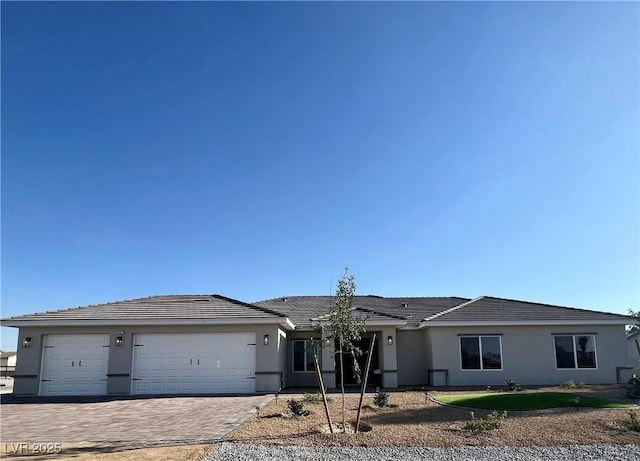 3791 Soplo Rd, Pahrump, NV 89048 - ranch-style house featuring driveway, an attached garage, and stucco siding