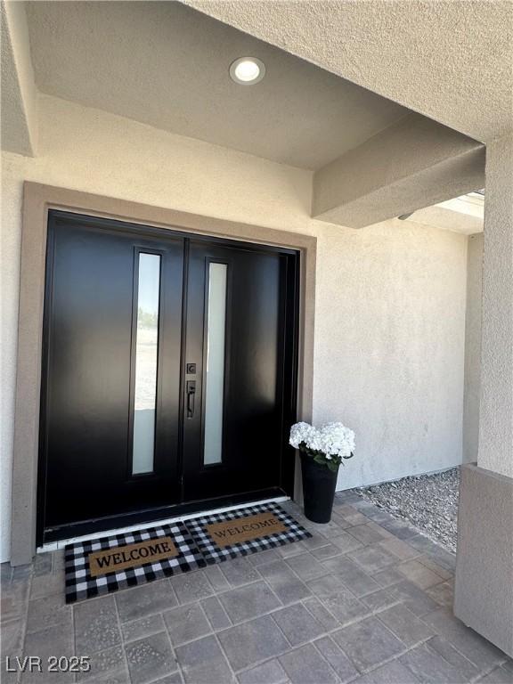 3791 Soplo Rd, Pahrump, NV 89048 - view of exterior entry featuring stucco siding