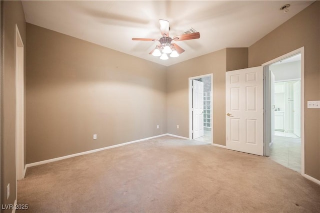 2050 W Warm Springs Rd Unit 4322, Henderson, NV 89014 - unfurnished bedroom featuring light carpet, baseboards, ensuite bath, and a ceiling fan