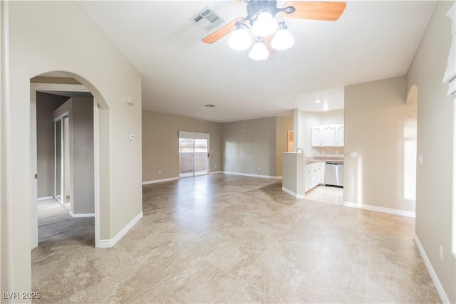 2050 W Warm Springs Rd Unit 4322, Henderson, NV 89014 - unfurnished living room featuring a ceiling fan, arched walkways, and baseboards