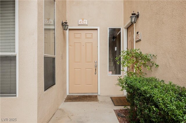2050 W Warm Springs Rd Unit 4322, Henderson, NV 89014 - doorway to property with stucco siding