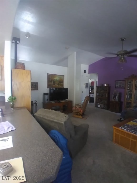 1611 Red Rock Dr, Pahrump, NV 89048 - living area featuring lofted ceiling, a ceiling fan, and carpet flooring