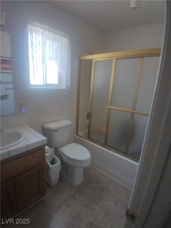 1611 Red Rock Dr, Pahrump, NV 89048 - bathroom with vanity, enclosed tub / shower combo, and toilet