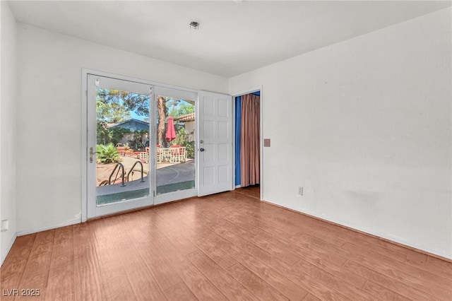 3158 La Luna Cir, Henderson, NV 89014 - unfurnished room with wood finished floors and baseboards