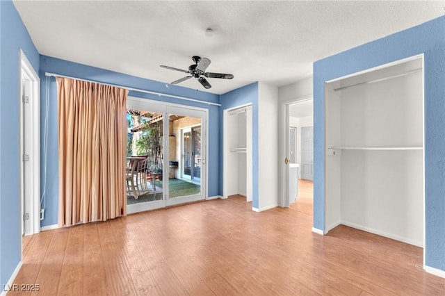 3158 La Luna Cir, Henderson, NV 89014 - unfurnished bedroom featuring access to outside, wood finished floors, and a ceiling fan