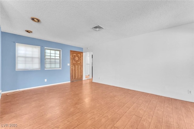 3158 La Luna Cir, Henderson, NV 89014 - spare room with a textured ceiling and light wood-type flooring