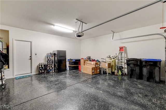 5434 Fawn Chase Way, Las Vegas, NV 89135 - garage featuring freestanding refrigerator and a garage door opener