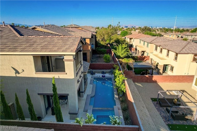 5434 Fawn Chase Way, Las Vegas, NV 89135 - view of property exterior with a residential view, stucco siding, a fenced backyard, and a tile roof