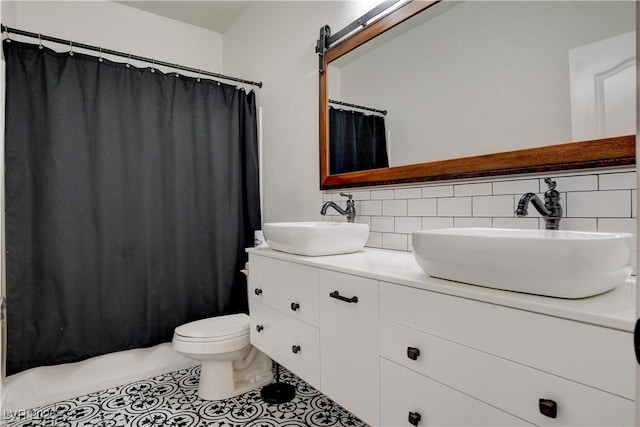 5434 Fawn Chase Way, Las Vegas, NV 89135 - full bathroom with tasteful backsplash, double vanity, toilet, tile patterned flooring, and shower / tub combo