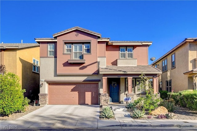 5434 Fawn Chase Way, Las Vegas, NV 89135 - view of front facade featuring a porch, driveway, a garage, and stucco siding