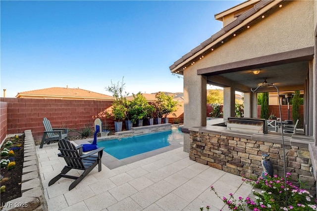 5434 Fawn Chase Way, Las Vegas, NV 89135 - view of pool featuring a patio, a fenced backyard, and exterior kitchen