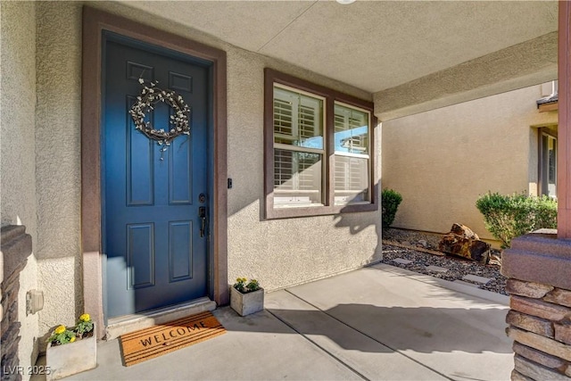 5434 Fawn Chase Way, Las Vegas, NV 89135 - property entrance with stucco siding and a porch