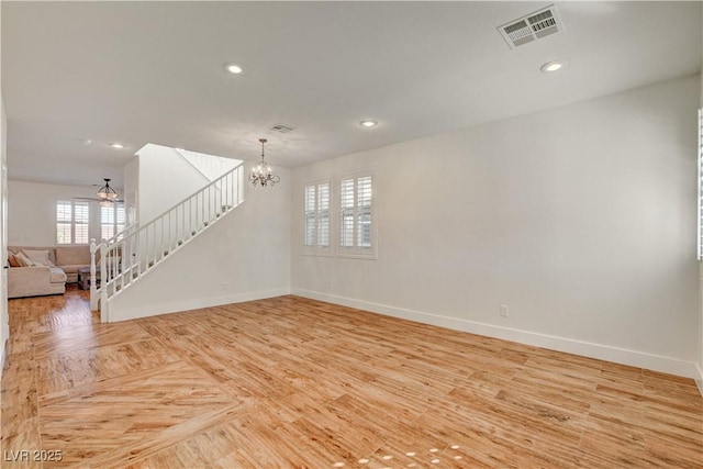 5434 Fawn Chase Way, Las Vegas, NV 89135 - empty room featuring a chandelier, baseboards, stairs, recessed lighting, and a ceiling fan