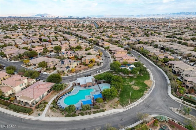 5434 Fawn Chase Way, Las Vegas, NV 89135 - aerial view of property and surrounding area with a mountainous background, a pool area, and nearby suburban area