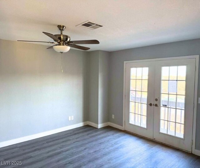 1967 N Moapa Valley Blvd, Logandale, NV 89021 - spare room with french doors, wood finished floors, and plenty of natural light