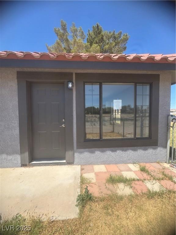 1967 N Moapa Valley Blvd, Logandale, NV 89021 - doorway to property featuring stucco siding