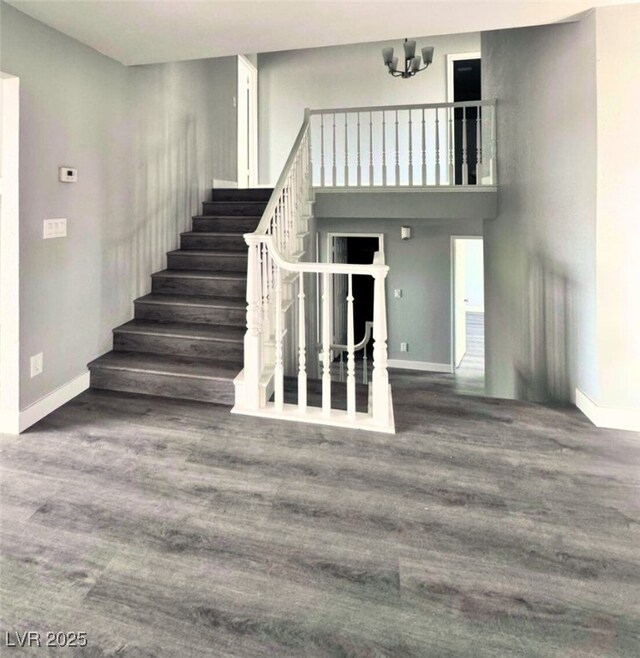 1967 N Moapa Valley Blvd, Logandale, NV 89021 - stairway with wood finished floors and a chandelier
